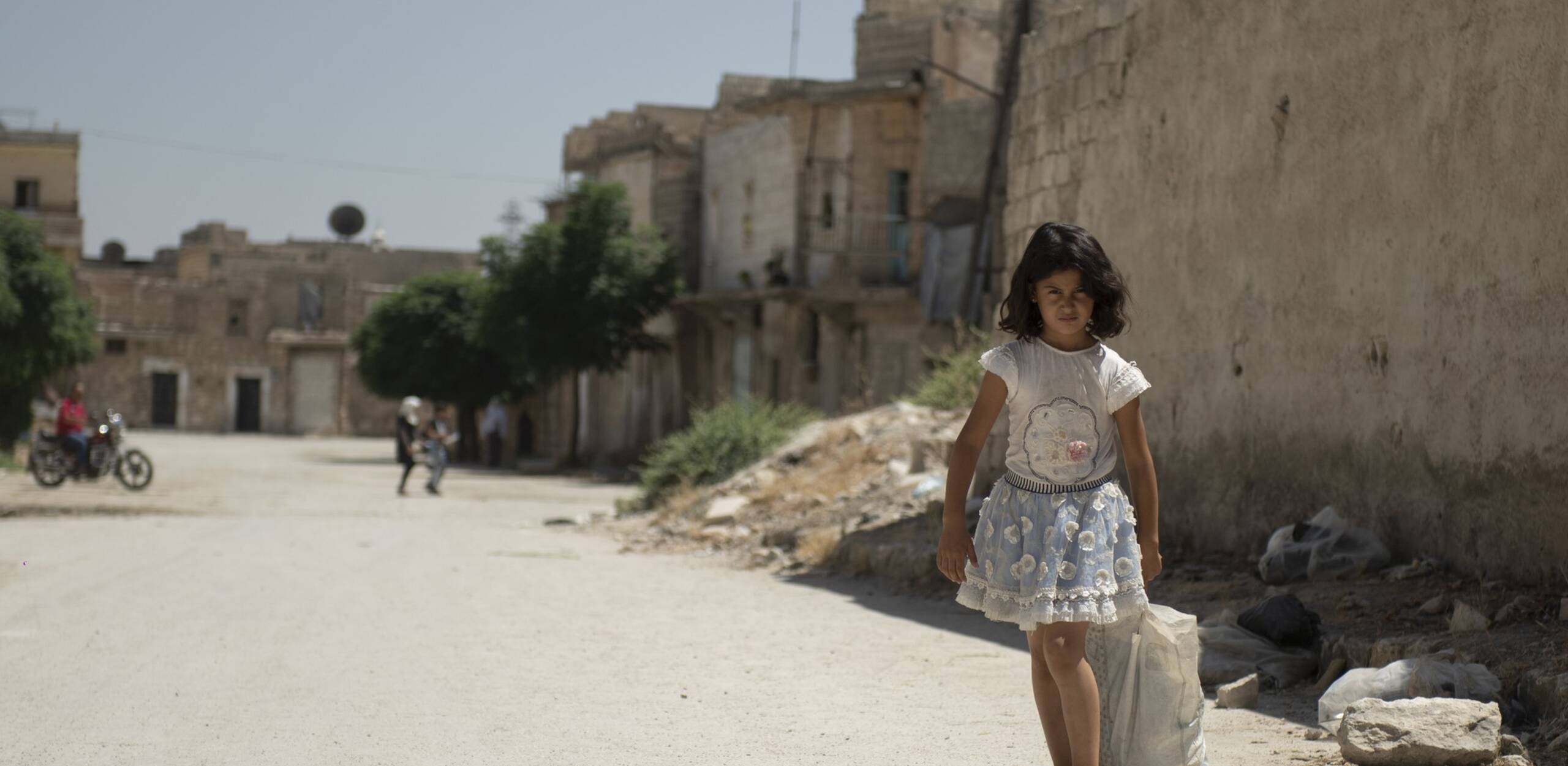 A girl walks through the Jabal Bedro neighbourhood in Aleppo, a city shattered by the earthquake and the war.