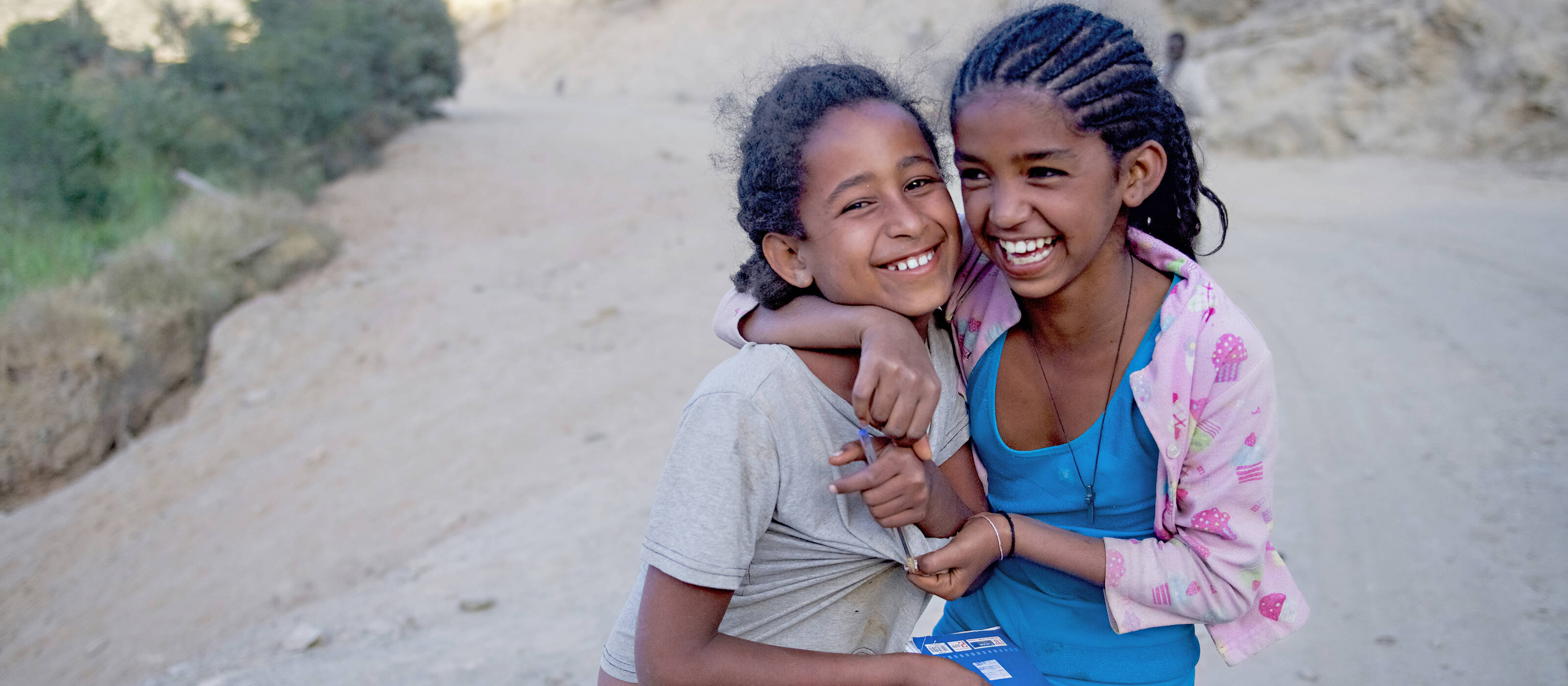 Unknown girls in Dowan, Tigray, Ethiopia play in the street.