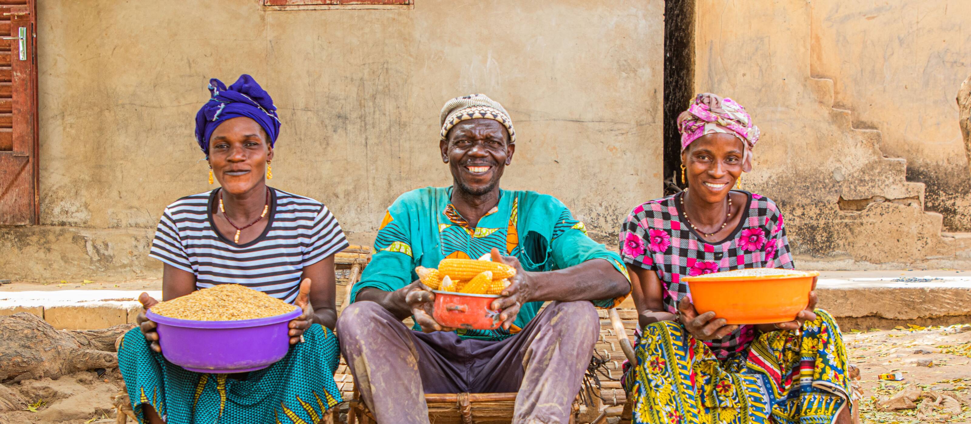Two female farmers and one male farmer in the village of Wegnia in Mali 