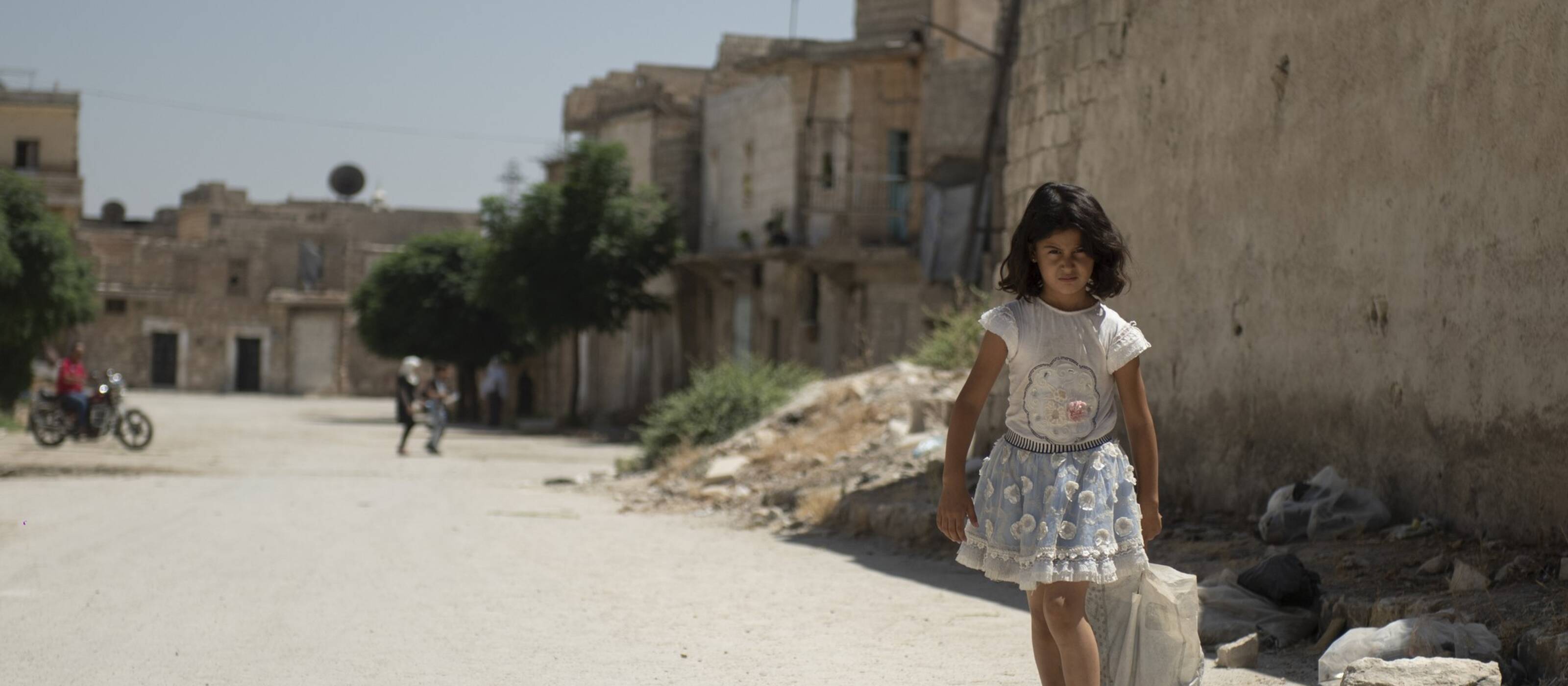 A girl walks through the Jabal Bedro neighbourhood in Aleppo, a city shattered by the earthquake and the war.
